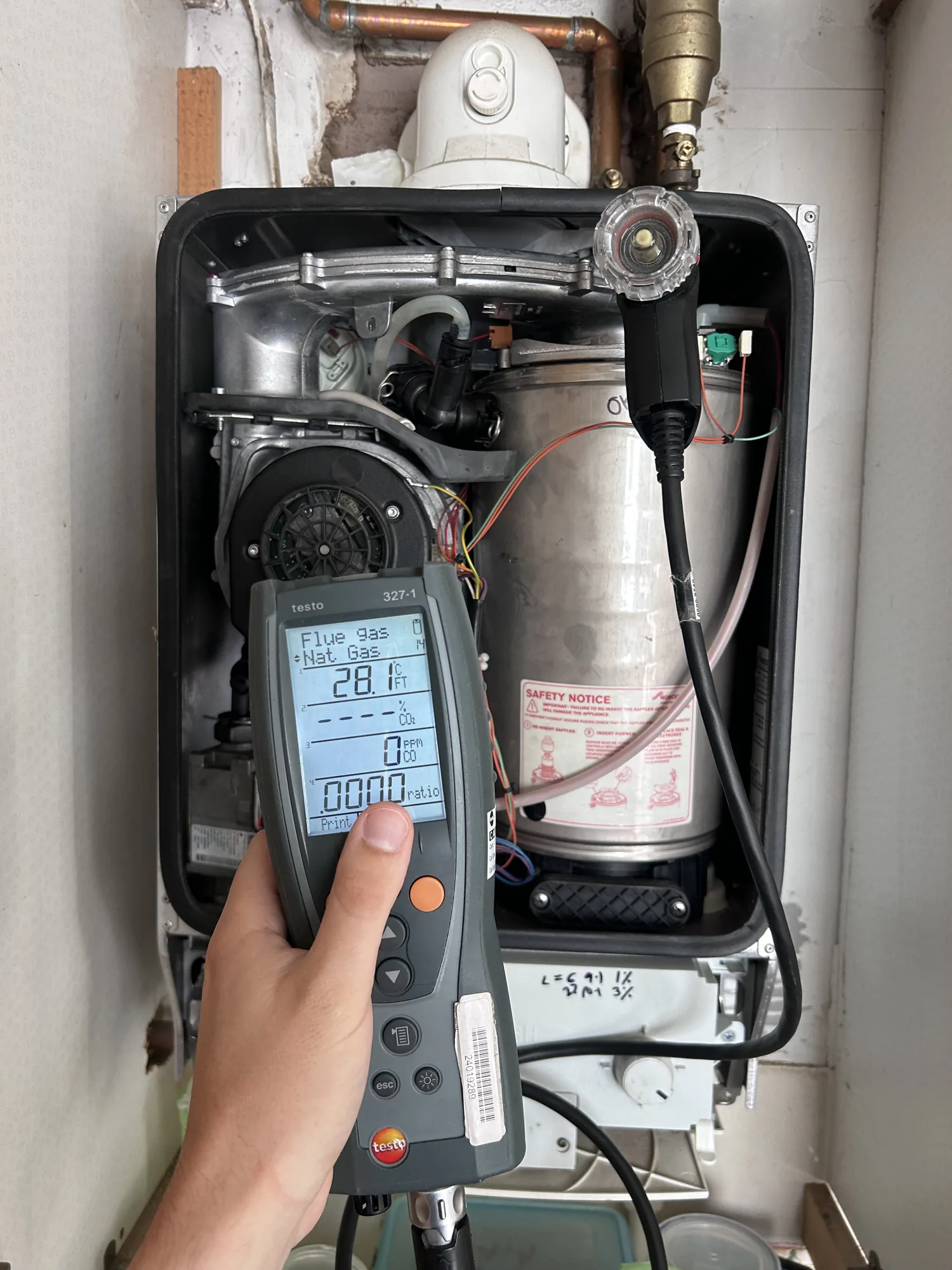Engineer diagnosing a boiler fault in Surrey
